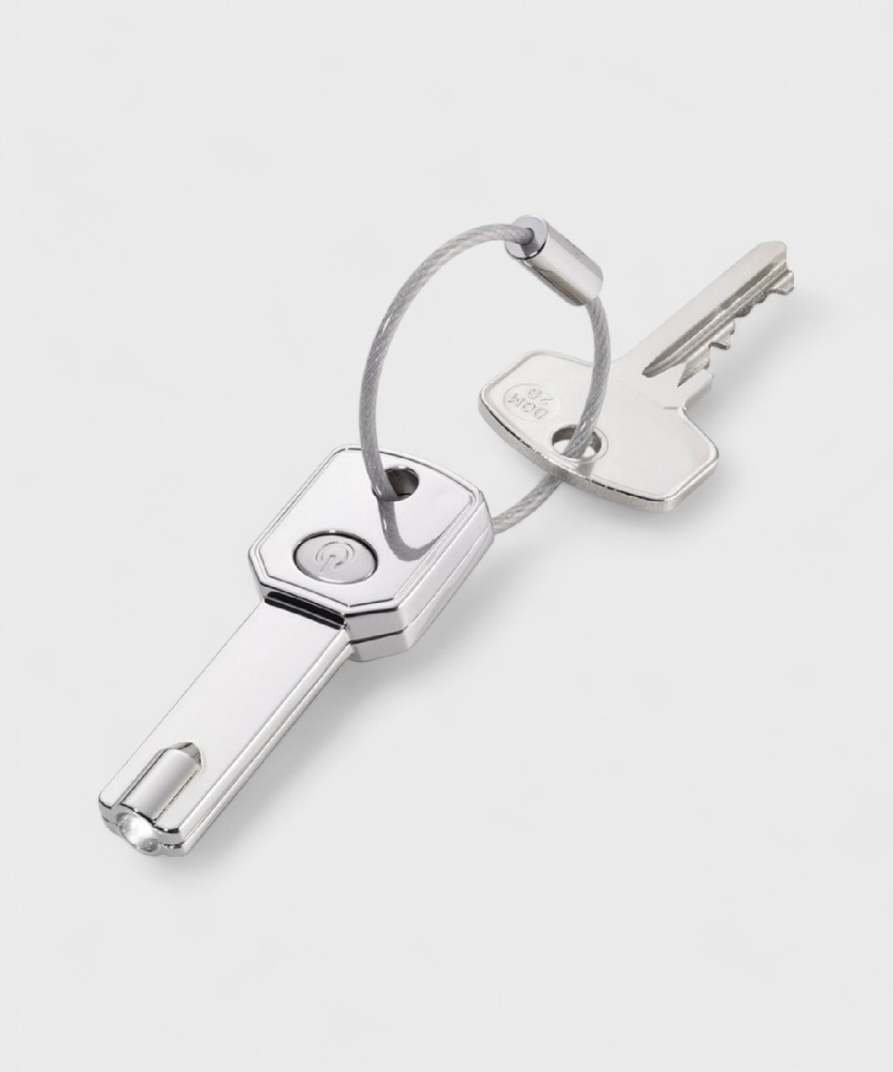 Troika light key keychain in the shape of a key...
